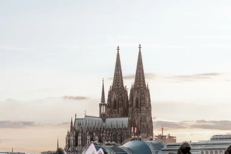 Cologne Cathedral rising above the stage at the Rheinterrassen in the evening light